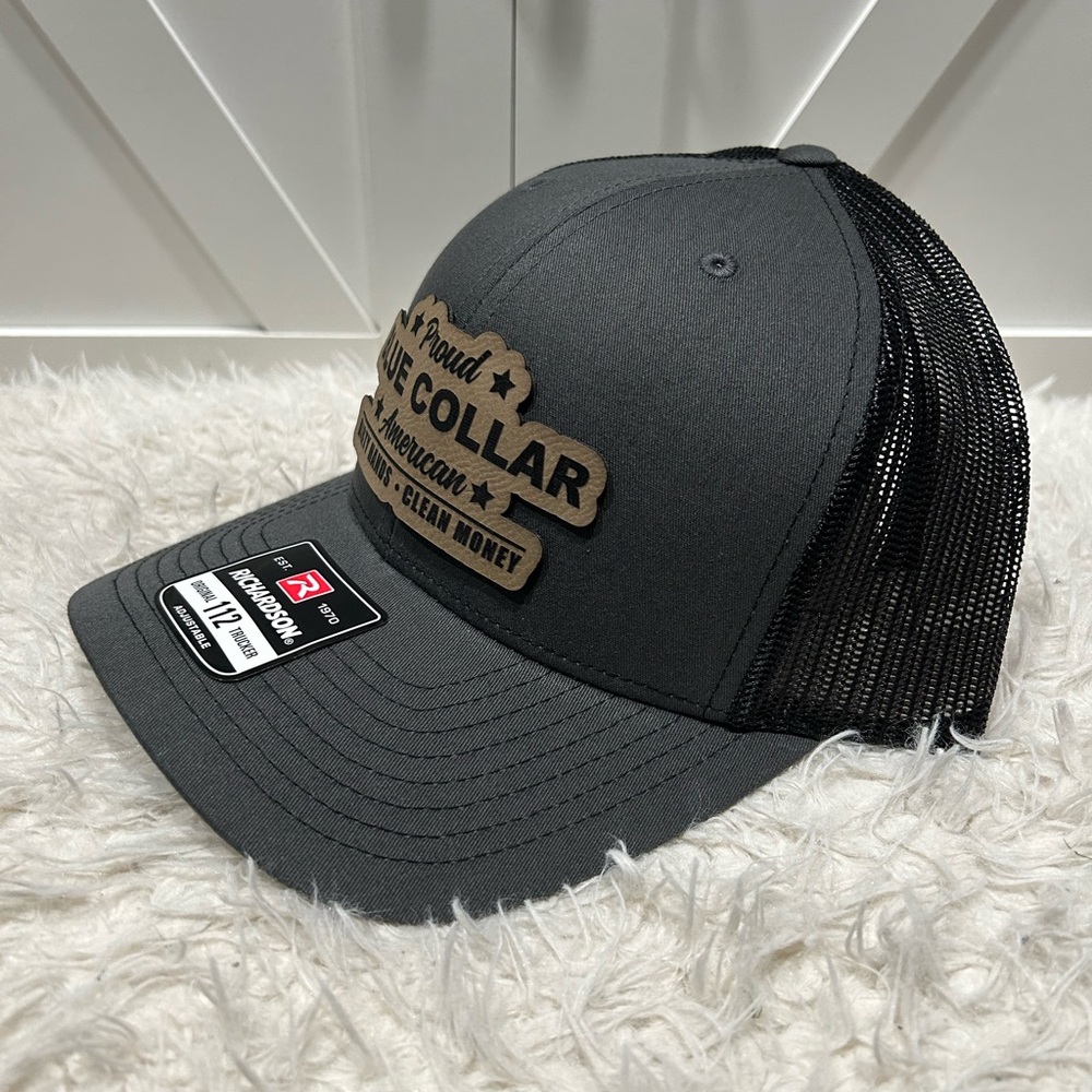 Proud blue collar American. Laser engraved Richardson 112 trucker hat.